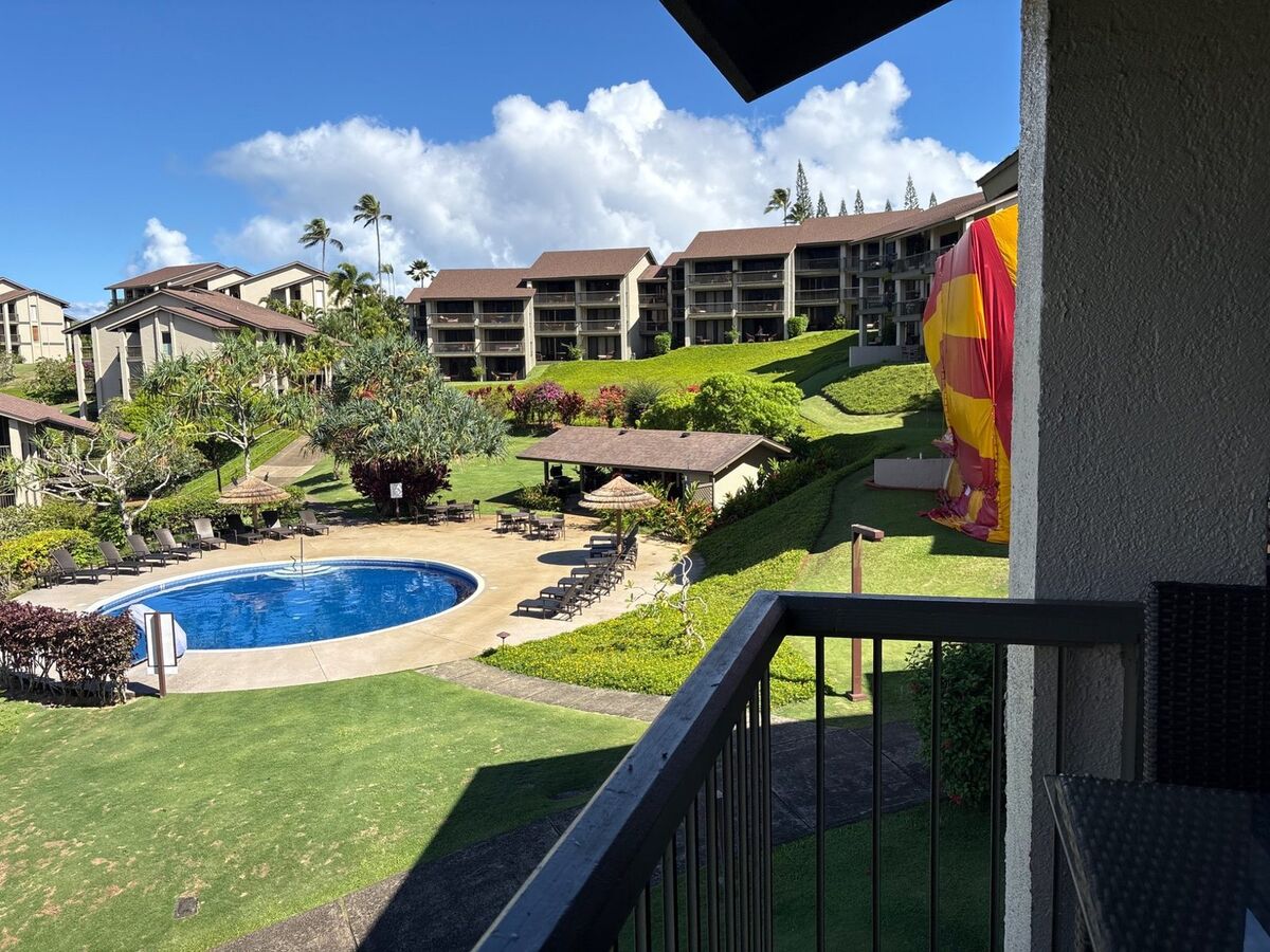 Condo inspection on Kauai with pool and winding path